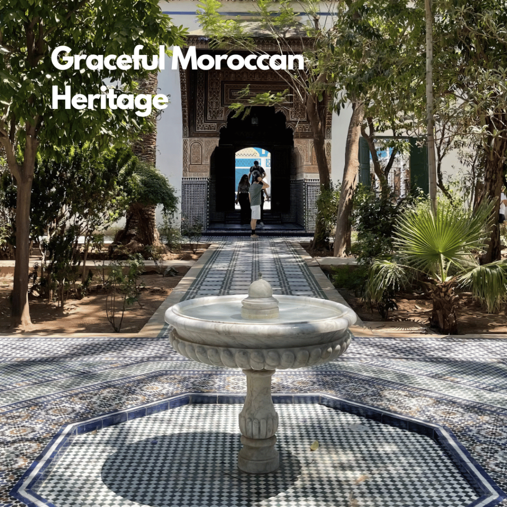 A beautiful courtyard at Bahia Palace in Marrakesh, showcasing intricate Moroccan tile work, lush greenery, and a peaceful fountain. The vibrant colors and detailed architecture reflect the palace's rich history and royal past.