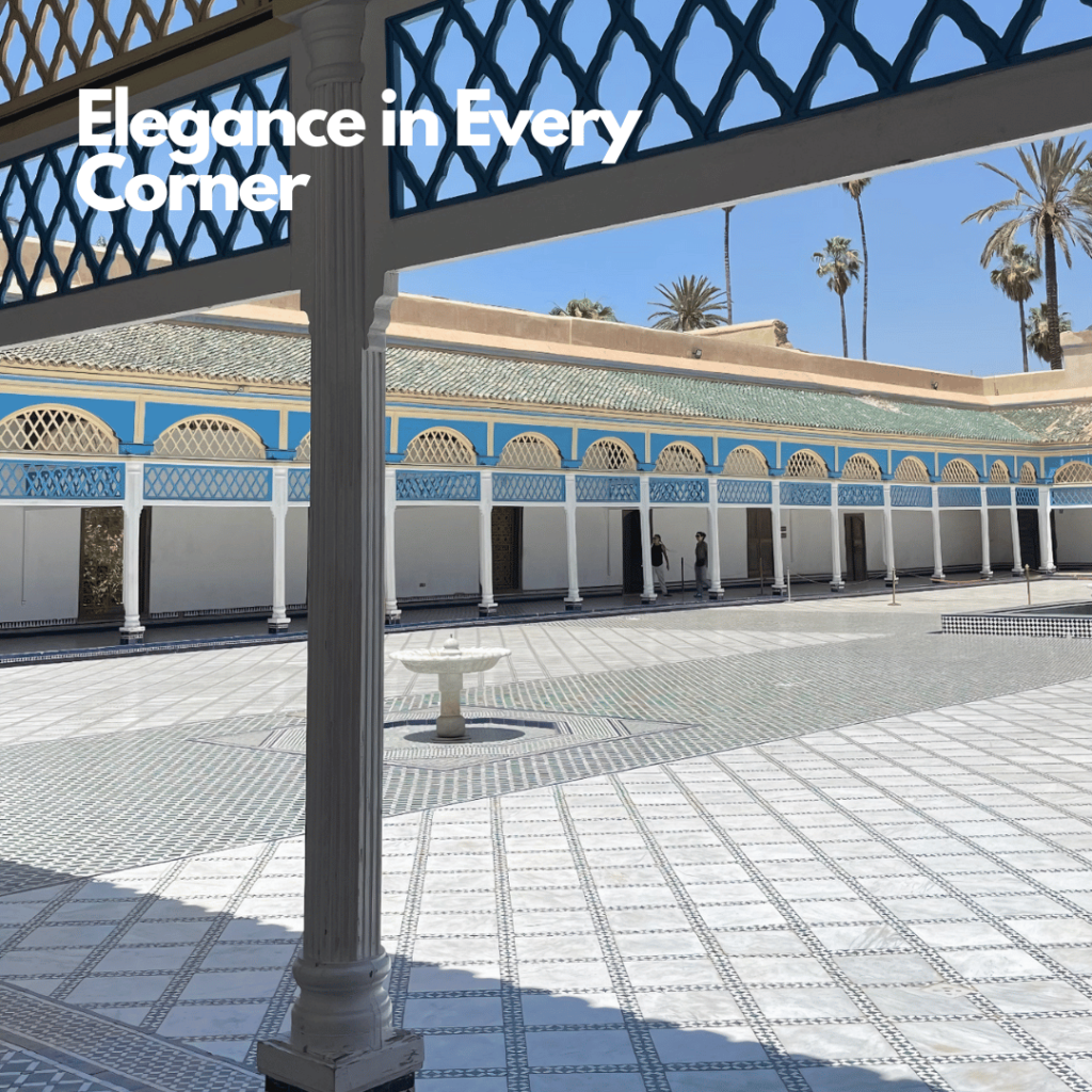 A beautiful courtyard at Bahia Palace in Marrakesh, showcasing intricate Moroccan tile work, lush greenery, and a peaceful fountain. The vibrant colors and detailed architecture reflect the palace's rich history and royal past.