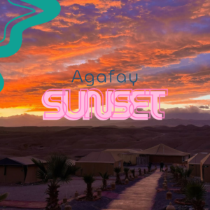 Sunset over Agafay Desert with golden skies and dunes.